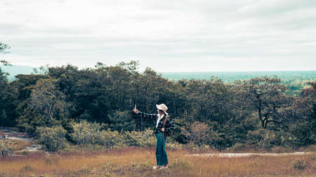Happy women backpack and enjoying with the beautiful nature relaxing on weekend.の写真素材