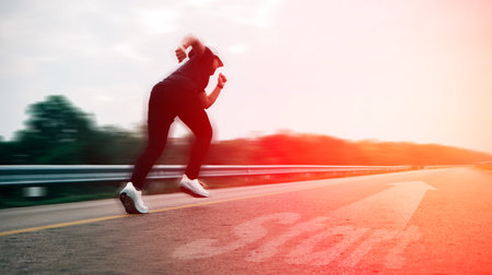 Women running on the road sets new goal to start running exercise. silhouette color style, selective and soft focus.の写真素材