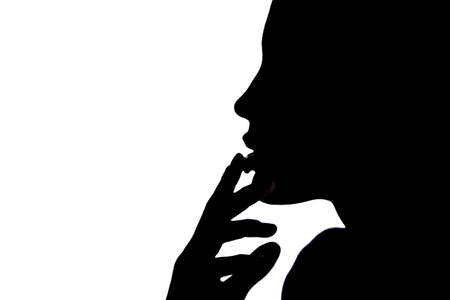 Profile of girl sexy backlit on white background  の写真素材