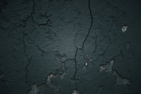 dark blue cracked concrete wall background or texture for design with copy spaceの素材