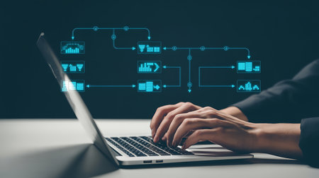 Businesswoman working on laptop computer with financial graph and chart on screenの素材