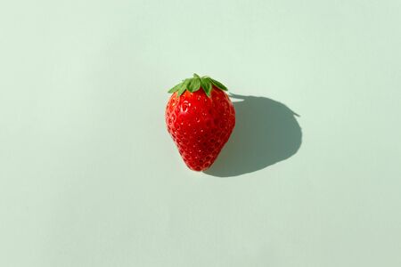 Top view of fresh juicy strawberry on pastel green background.の写真素材