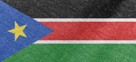 South Sudan fabric flag, fabric texture background. National flag of South Sudanの写真素材