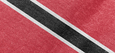 National flag of Trinidad and Tobago. Fabric texture of the flag.の写真素材