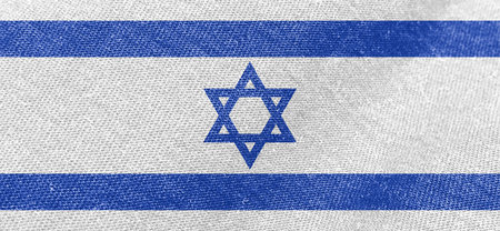 Israel fabric flag. Patriotic background. National flag of Israel in fabric textureの写真素材