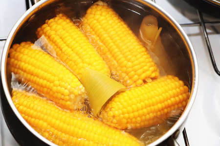 Yellow corn stew in a saucepan. Flavored dinnerの写真素材