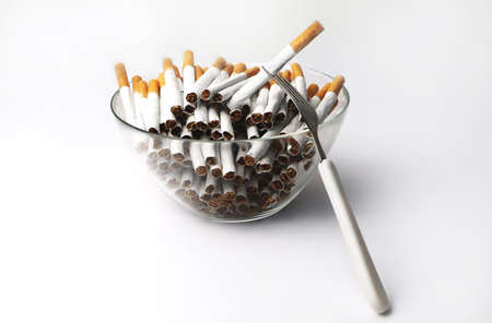 A lot of cigarettes in the plate. The concept of addiction from addiction - smoking