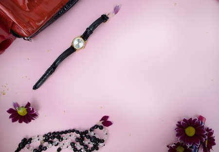 Cosmetics on the table at the woman. Cosmetic bag, cosmetic and hygiene products. Pink background for textの写真素材