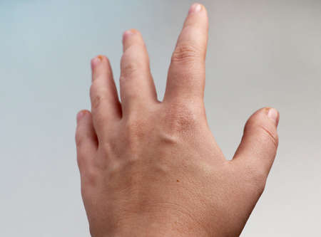 Woman's hand on a light background. Open palmの写真素材