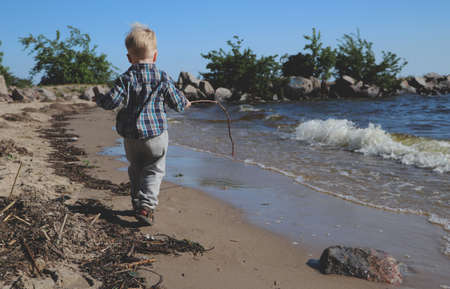 Little boy playing on the beachの写真素材