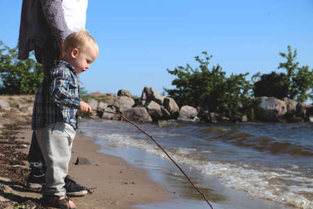 Little boy playing on the beachの写真素材