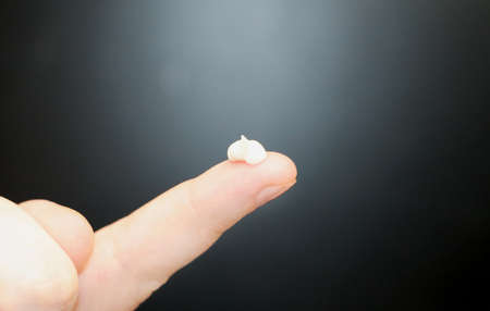 Woman hands with cream, isolated on black
