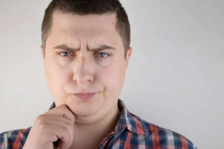 The man has a second chin. The concept of obesity and plastic surgery of the face. Close-up of a...