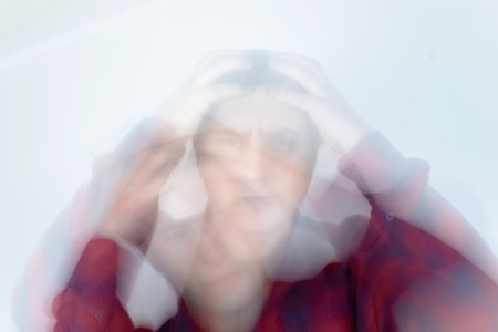 Man loses consciousness and falls down due to dizziness and disturbance of the vestibular apparatus. Severe headache and migraine. Concept of helping people suffering from migraines and dizzinessの写真素材