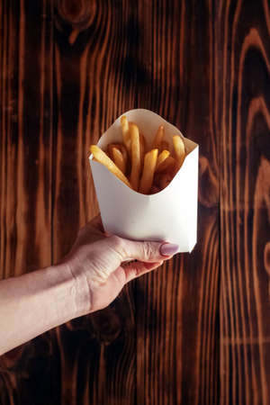 Top view of French fries. The concept of fast food, quick bites and restaurants for catering....