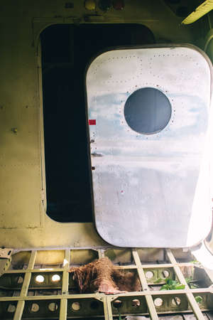 A close-up of an old wrecked passenger plane that has been decommissioned and stands for tourists....