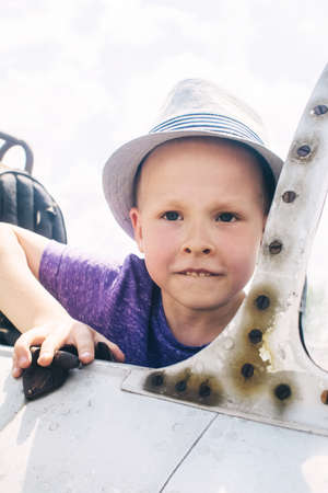 Close-up of a military fighter pilot's cockpit. A crack is visible on the glass, which has turned yellow with age. Decommissioned military equipment. Airplane pilot seatの写真素材