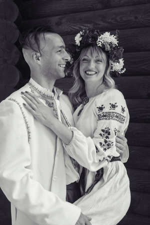 Young people dressed in vintage outfits to get married in the church. Reconstruction of Cossack customs in Ukraine. Old Slavic customs and traditional historical costumes. Stylized weddingの写真素材