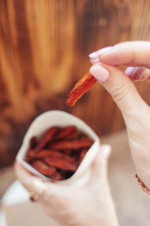 Ð¡arrot fries in a cardboard box. Vegetarian fast food dish. Grilled vegetables. BBQ cooking concept for people who do not eat meat or like vegetablesの写真素材