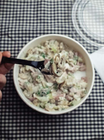 Salad in a disposable glass close-up. Healthy and fast food. Takeaway cafe. Disposable tableware for food safety. Healthy fast foodの写真素材