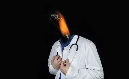 match concept. The doctor is tired from work and without strength. work burnout. psychological problems. Fatigue and stress. The concept of a work crisis and change of occupation. professional crisisの写真素材