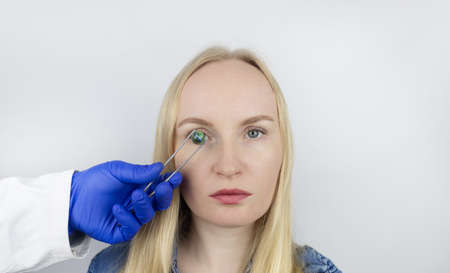 Conceptual shot of an eye crystalline lens replacement. Ophthalmic surgery. Return of sight. Removal...
