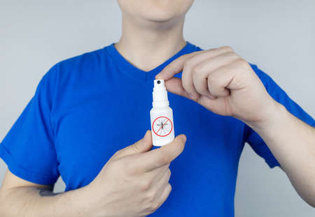 Mosquito repellent. Close-up of an insect repellant spray. Means for repulsion of blood-sucking parasites. concept photoの写真素材