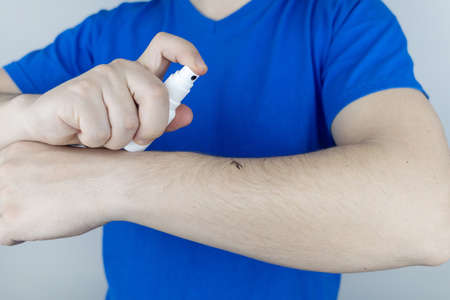 Mosquito repellent. Close-up of an insect repellant spray. Means for repulsion of blood-sucking parasites. concept photoの写真素材
