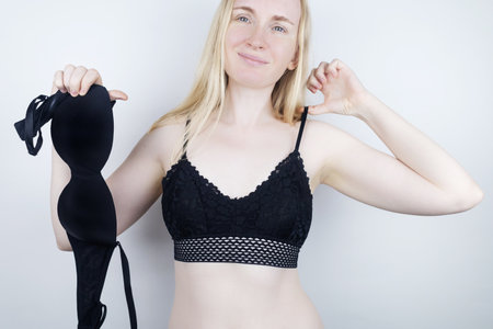 Uncomfortable bra. Bra marks. Non-anatomical underwear causing squeezing and rubbing of mammary glands. Mastopathy and mastalgia. Women choose convenient, and discarded the uncomfortable.の写真素材