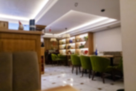 Cafe blur. Restaurant interior is blurry. Cafe background. order food, Interior design for a food establishment in dim light and with strong blur so that it is impossible to determine the locationの写真素材