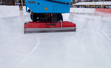 Ice cleaning machine. General and close-up of a professional machine for preparing an ice rink. Place for text. Speed skating, hockey and other winter sportsの写真素材