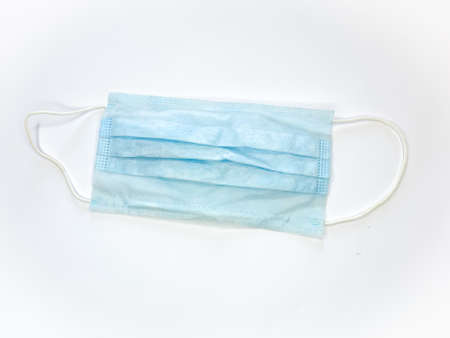 Antibacterial medical mask of blue color on a white background virus epidemic corona virus...