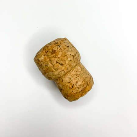 Sparkling wine champagne wooden cork on white background close up imageの写真素材