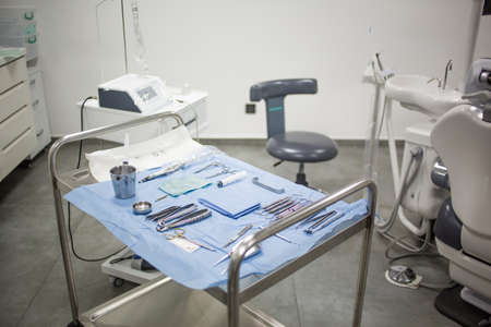 Modern dental clinic cabinet - dentist chair, equipment and tools. Dentistry, medical office.