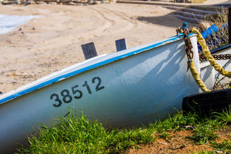 A fishing boat anchor on the beachの写真素材