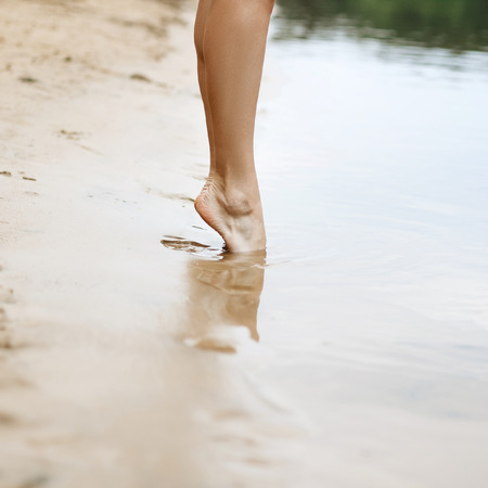 Beautiful woman legs. It should be in the water.の写真素材