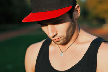 Dancer in a red cap in the park.