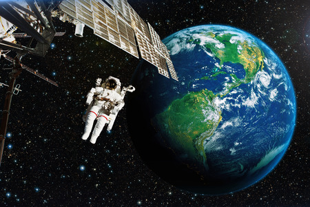 Astronaut in outer space against the backdrop of the planet earth. の写真素材