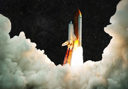 Spaceship takes off into space. Rocket flies on a background of the starry sky