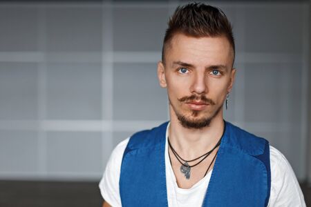 Portrait of stylish man with a mustache and beard, indoorsの写真素材