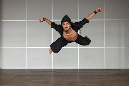Male dancer jumping in the airの写真素材