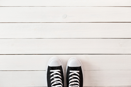Black shoes on a wooden white tableの写真素材