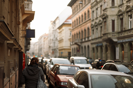 Woman walks on the street. Travel through the historic city in Europe. Budapest, Hungary.の写真素材