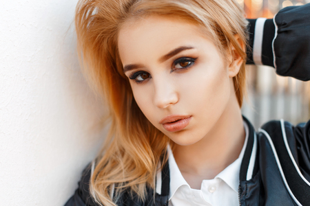 Portrait of a beautiful young blond woman on a sunny dayの写真素材