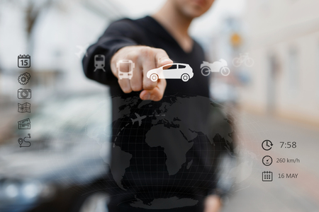 Close up of man touching digital travel screen with finger. The concept of travel, the choice of the way of travel