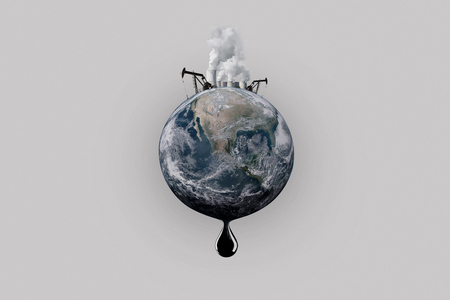 pollution of the planet earth. Oil production, pipes with smoke, a drop of oil. The end of oil reservesの写真素材