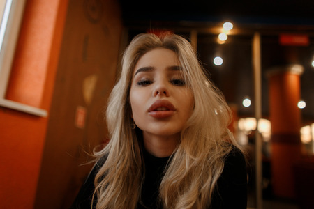 Stylish fashionable woman with big lips indoorsの写真素材