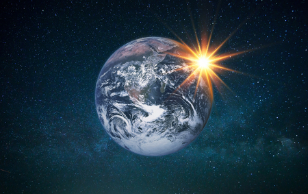 Planet Earth with sun rays in the starry sky. Earth with the sun in space.の写真素材