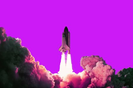 Rocket takes off in the pink sky. Spaceship begins the mission on a pink background. Space shuttle...