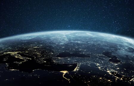 Beautiful planet earth with night city lights. Europe and Africa at night viewed from space with...